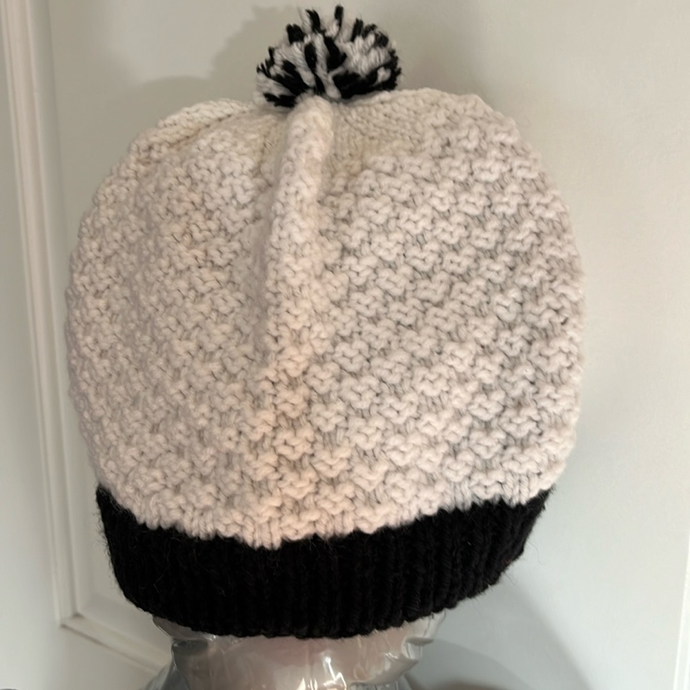 Slouchy cap with pom-pom and knitted black-and-white hat